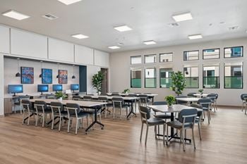 Computer lab with workstations and communal tables